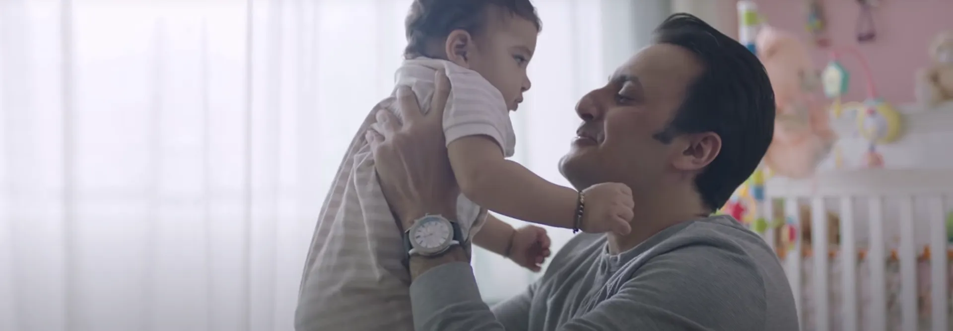 man with the baby image